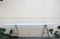 Early in the shaping process when it looks kinda like a weird thing on two sawhorses. Late on it would like a weird thing covered in fiberglass.